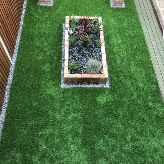 40mm artificial grass installed around raised garden bed