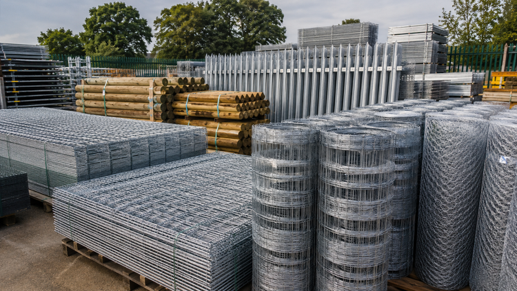 Galvanised fencing and wire mesh products in UK supply yard
