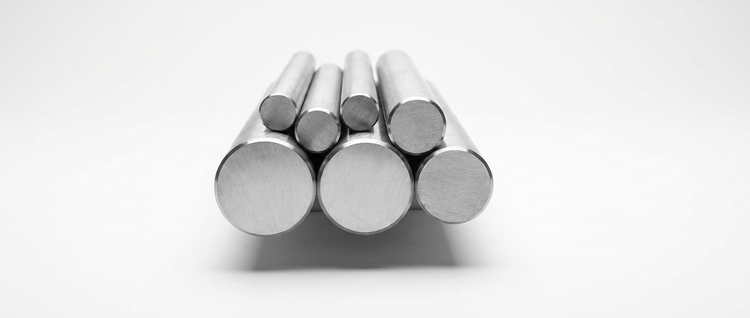 Solid steel round bars of various diameters on a white background