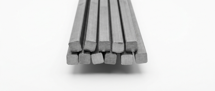 Solid steel square bars on a white background