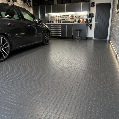 Black coin rubber flooring installed in home garage
