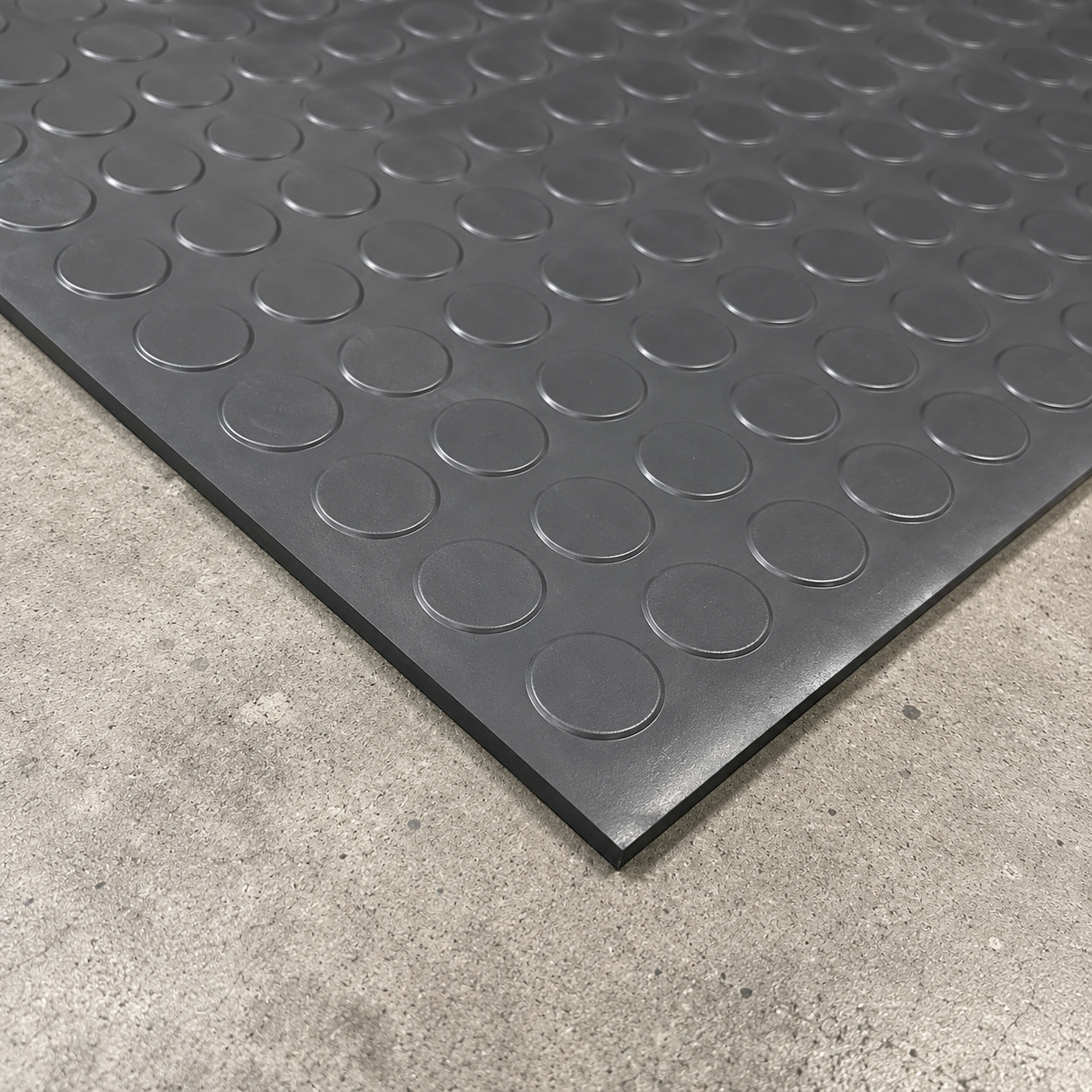 Heavy-duty coin pattern garage flooring corner detail