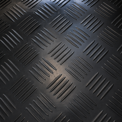 Detailed view of black 1.5m wide 3mm 5 bar checker rubber flooring, highlighting raised anti-slip tread