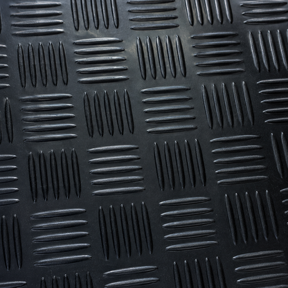 Close-up of black 1.5m wide 3mm 5 bar checker rubber flooring texture, showing pattern and finish