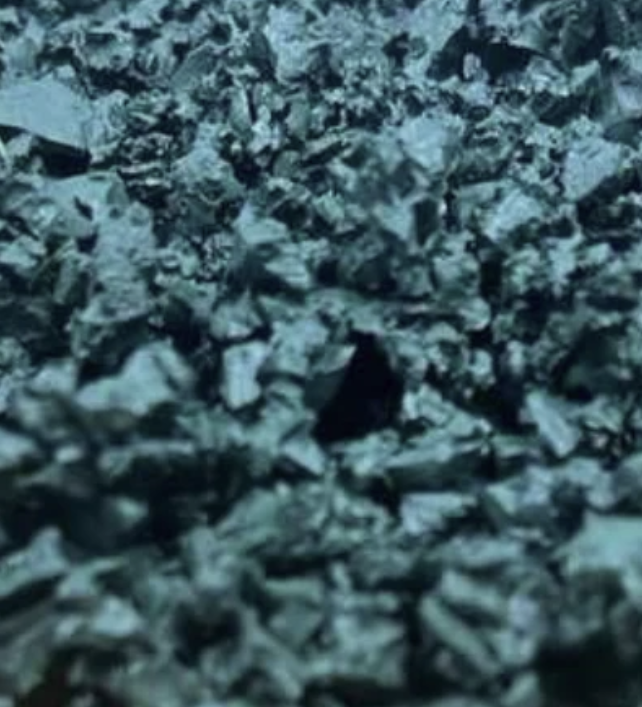 Close-up of moss green rubber chippings mix