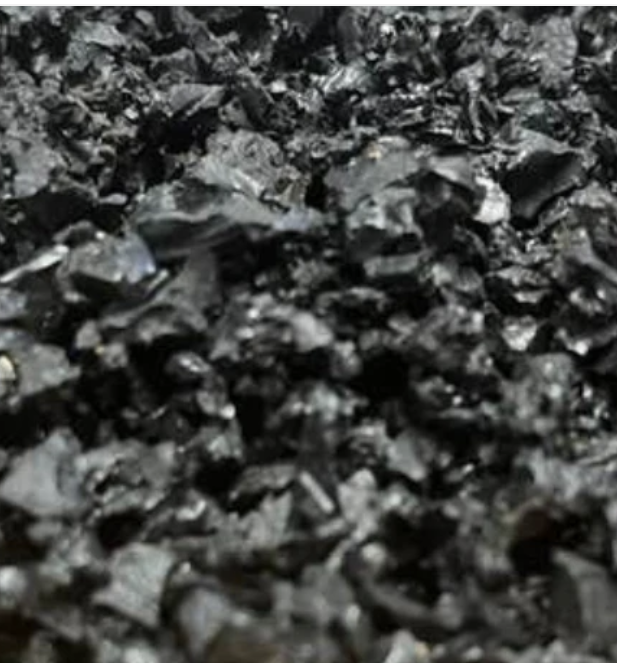Close-up of black playground rubber chippings