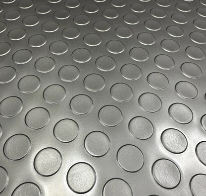 Close-up of black coin PVC garage flooring texture