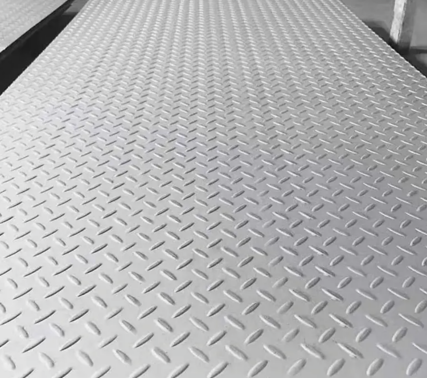 Image 4:  mild steel durbar checker plate edge and surface — raised pattern anti-slip S275 sheet