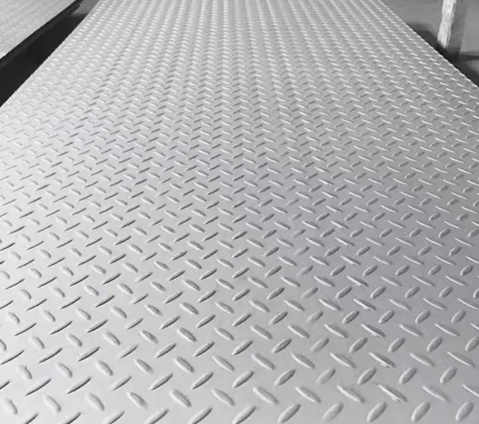 Image 4:  mild steel durbar checker plate edge and surface — raised pattern anti-slip S275 sheet