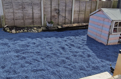 Blue playground rubber chippings installed in garden play area