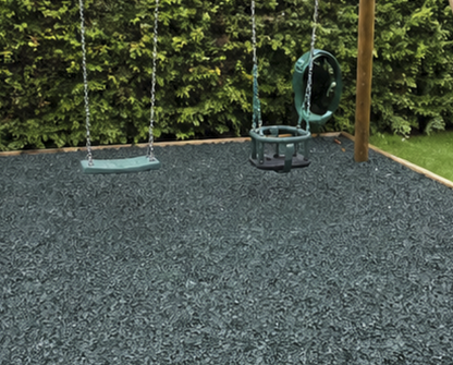 Grey playground rubber chippings under swing set