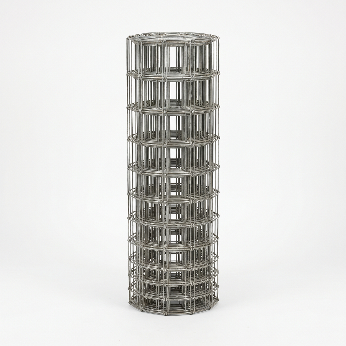 Roll of galvanised stock fencing on a white studio background