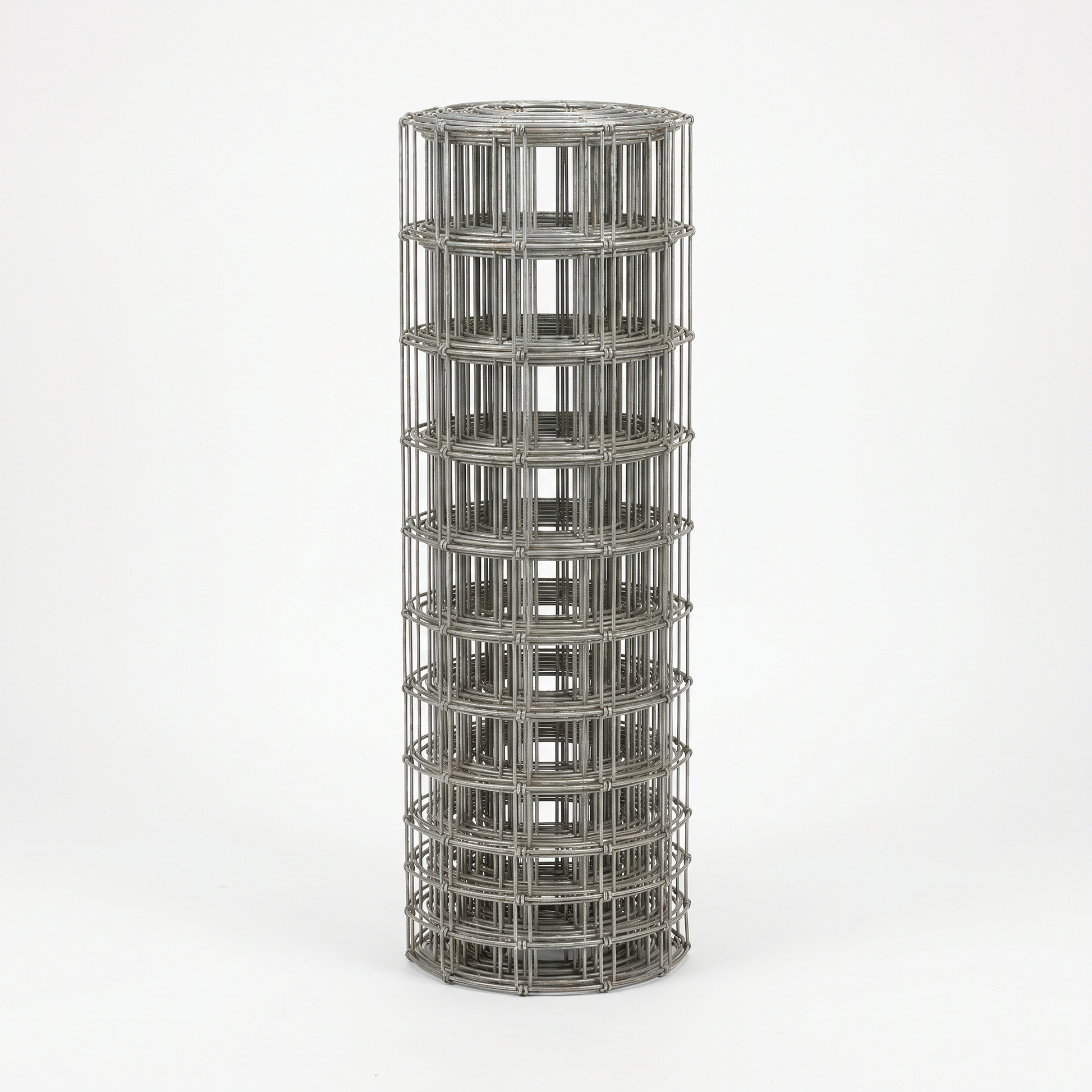 Roll of galvanised stock fencing on a white studio background