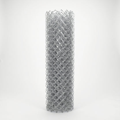 Roll of galvanised chain link fencing on a white studio background