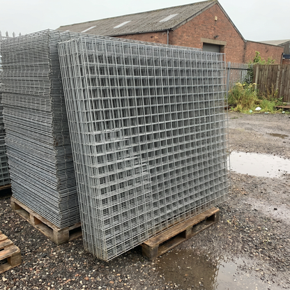 Stack of galvanised welded mesh panels in a yard