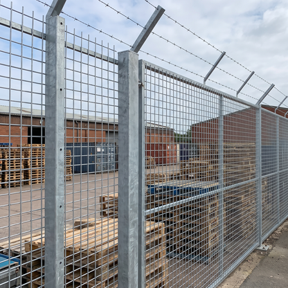 Heavy galvanised 50mm weld mesh security fence at a UK yard
