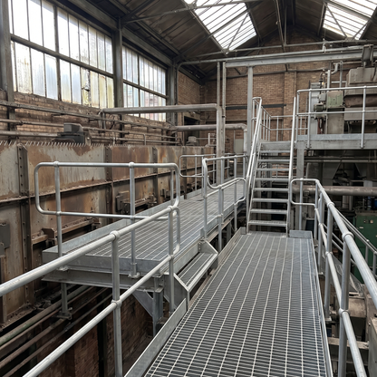 Galvanised open steel flooring walkway on an industrial platform