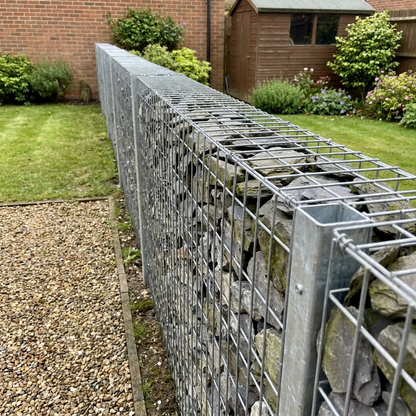 Gabion fence made from 4mm gabion baskets on steel posts
