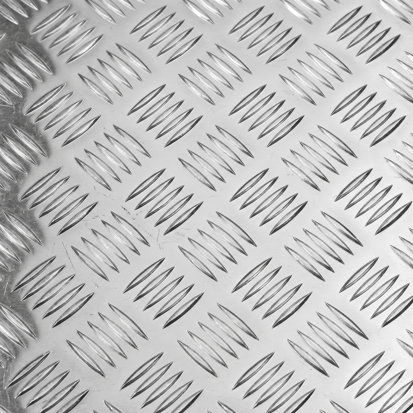 Aluminium chequer plate 8x4 raised five-bar tread pattern close-up - 5754 bright aluminium