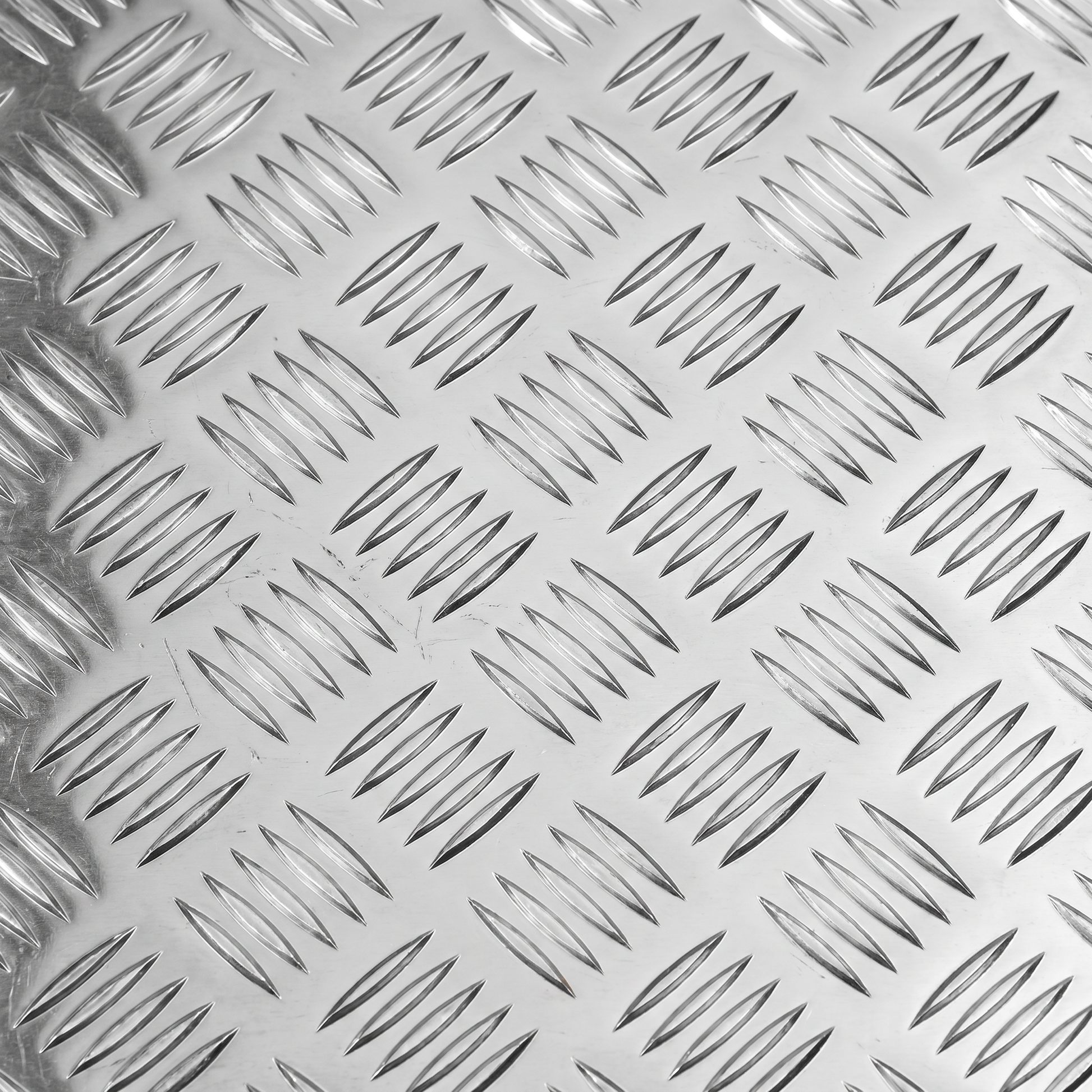 Aluminium chequer plate 8x4 raised five-bar tread pattern close-up - 5754 bright aluminium