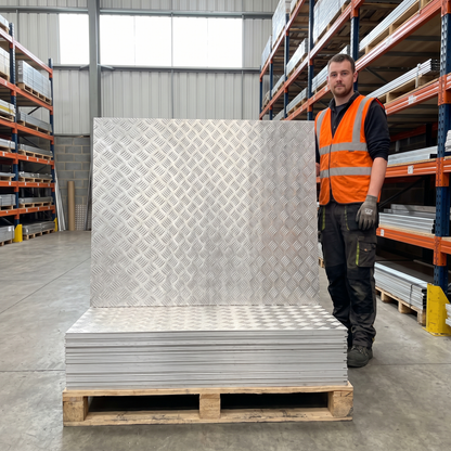 Aluminium chequer plate 8x4 stacked on pallet at UK stockholder - 5754 five-bar tread plate