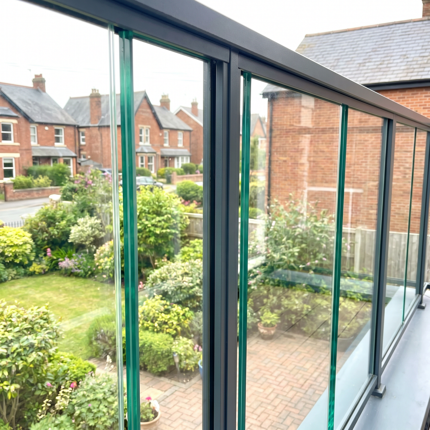 12mm toughened glass infill panels in a framed balustrade on a UK balcony
