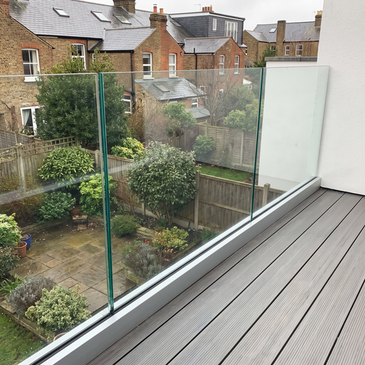 17.5mm toughened laminated glass balustrade in a base channel on a UK balcony