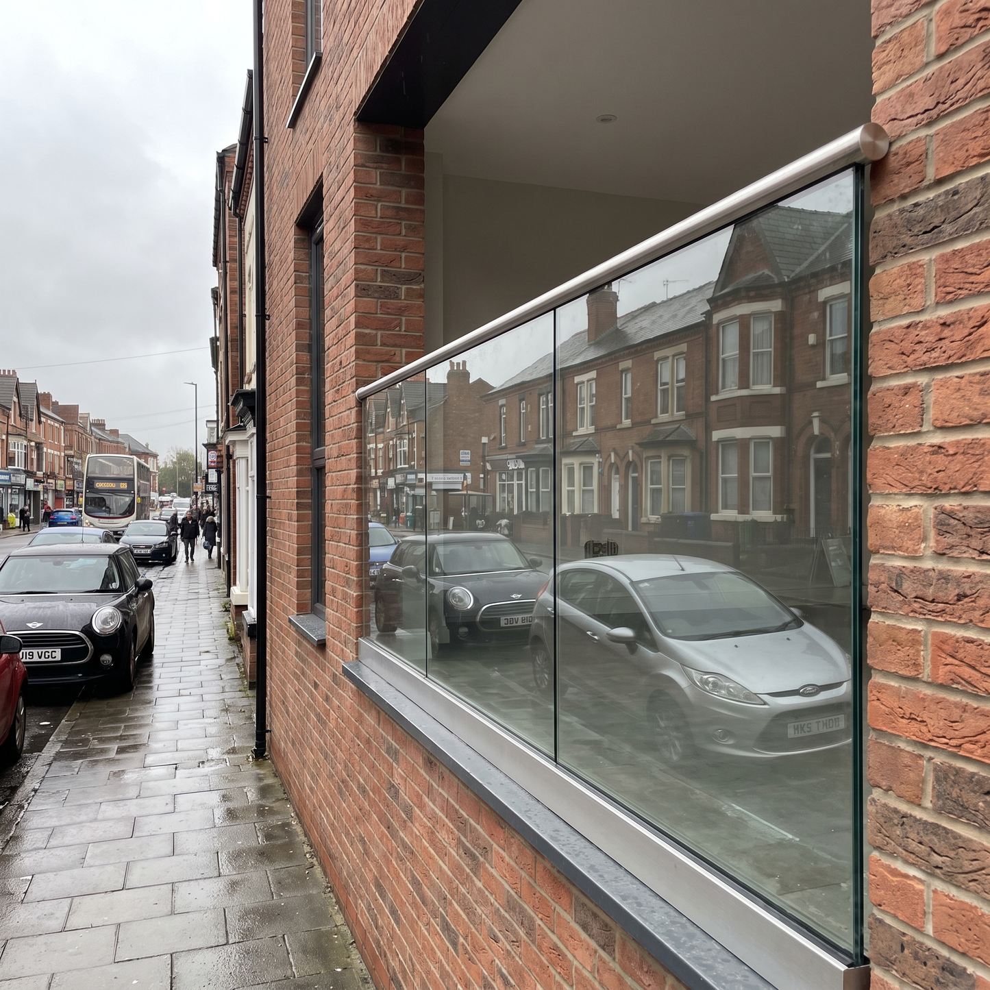 Frameless laminated glass Juliet balcony on a UK home