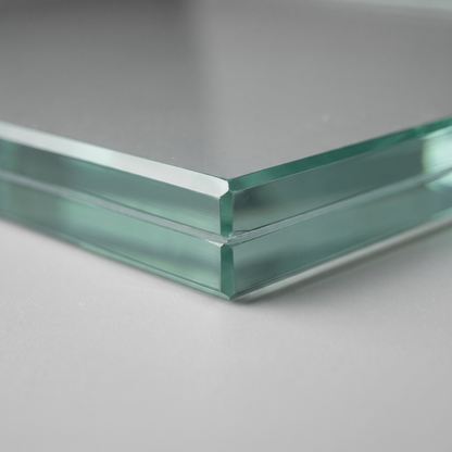 Edge of 21.5mm laminated glass showing two 10mm toughened plies and PVB interlayer with a dubbed corner