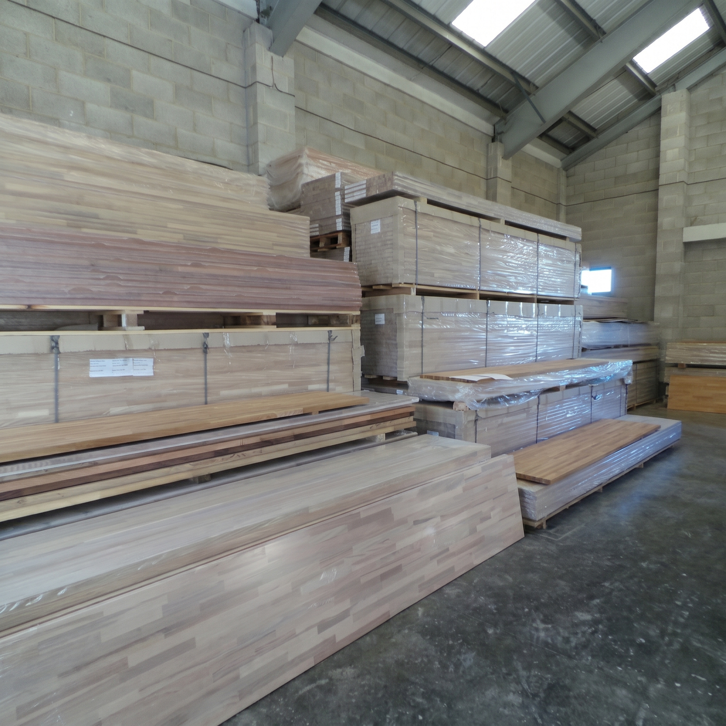 Stacked solid beech worktops in warehouse
