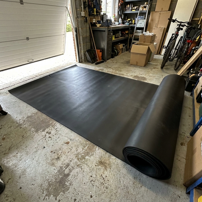 Smooth 5mm heavy-duty rubber garage flooring roll 1.5m wide unrolled on a garage floor