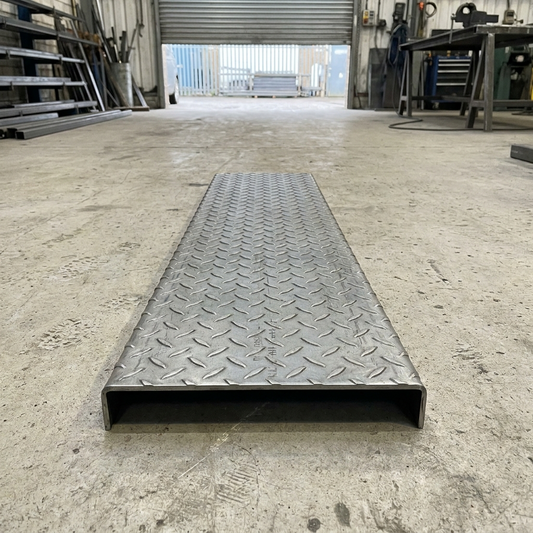 Steel durbar checker plate stair tread with folded turn-down nosing, mild steel S275