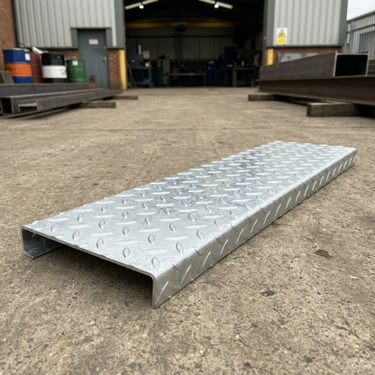 Hot-dip galvanised steel durbar checker plate stair tread with folded nosing