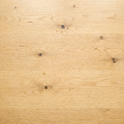 Close-up of light oak worktop surface showing natural wood grain and knots