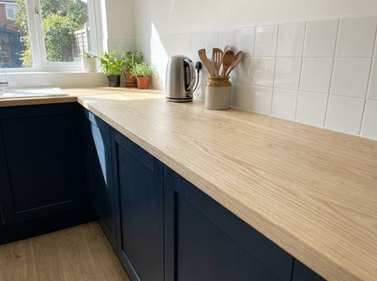 Solid ash kitchen worktop 40mm in a navy shaker kitchen