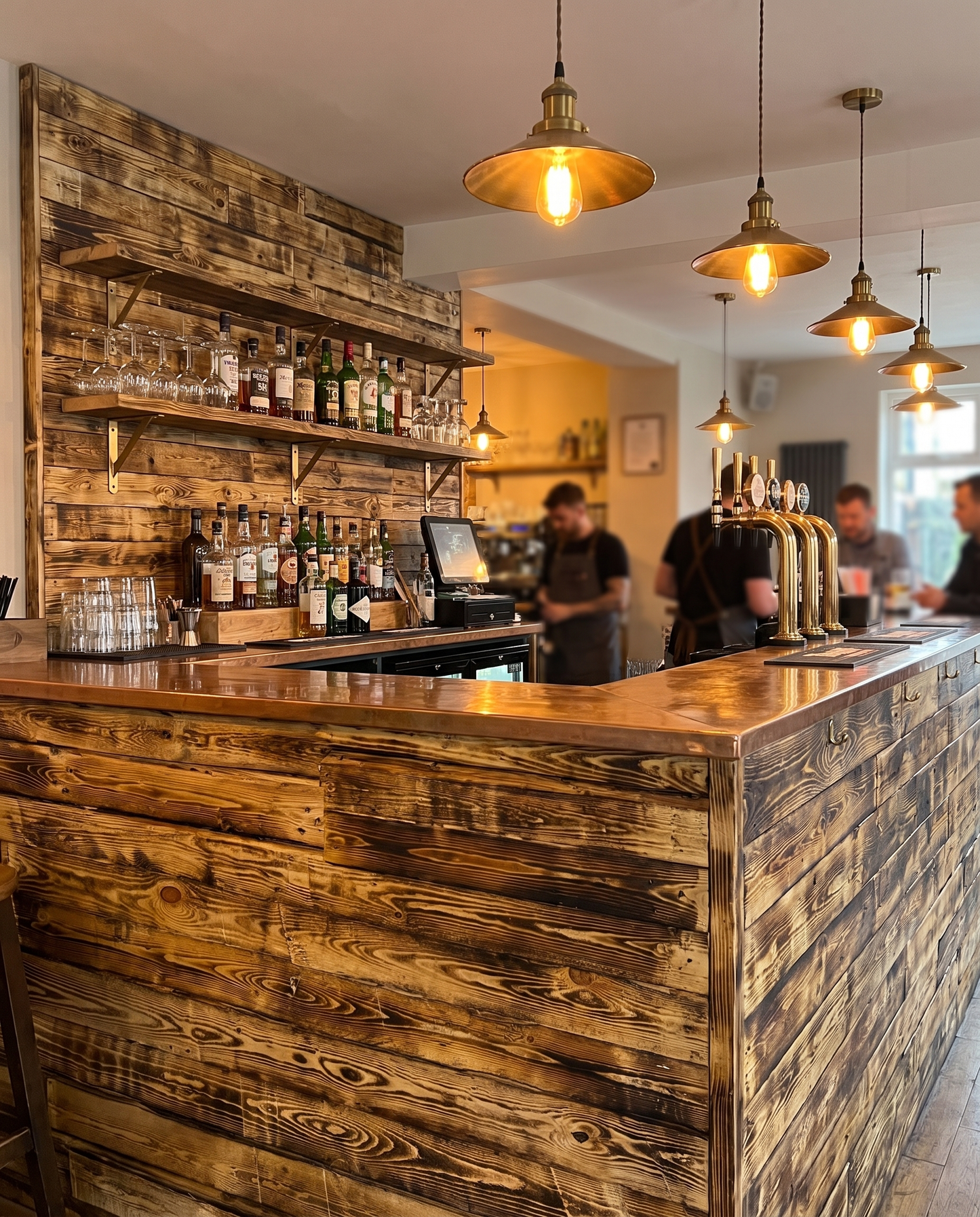 Scorched charred timber cladding on a bar counter and back wall