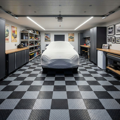 Interlocking PVC garage floor tiles in a home garage with covered car and storage cabinets
