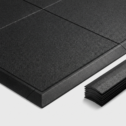 Interlocking non-trip bevelled edge finishing strip on rubber gym floor tiles