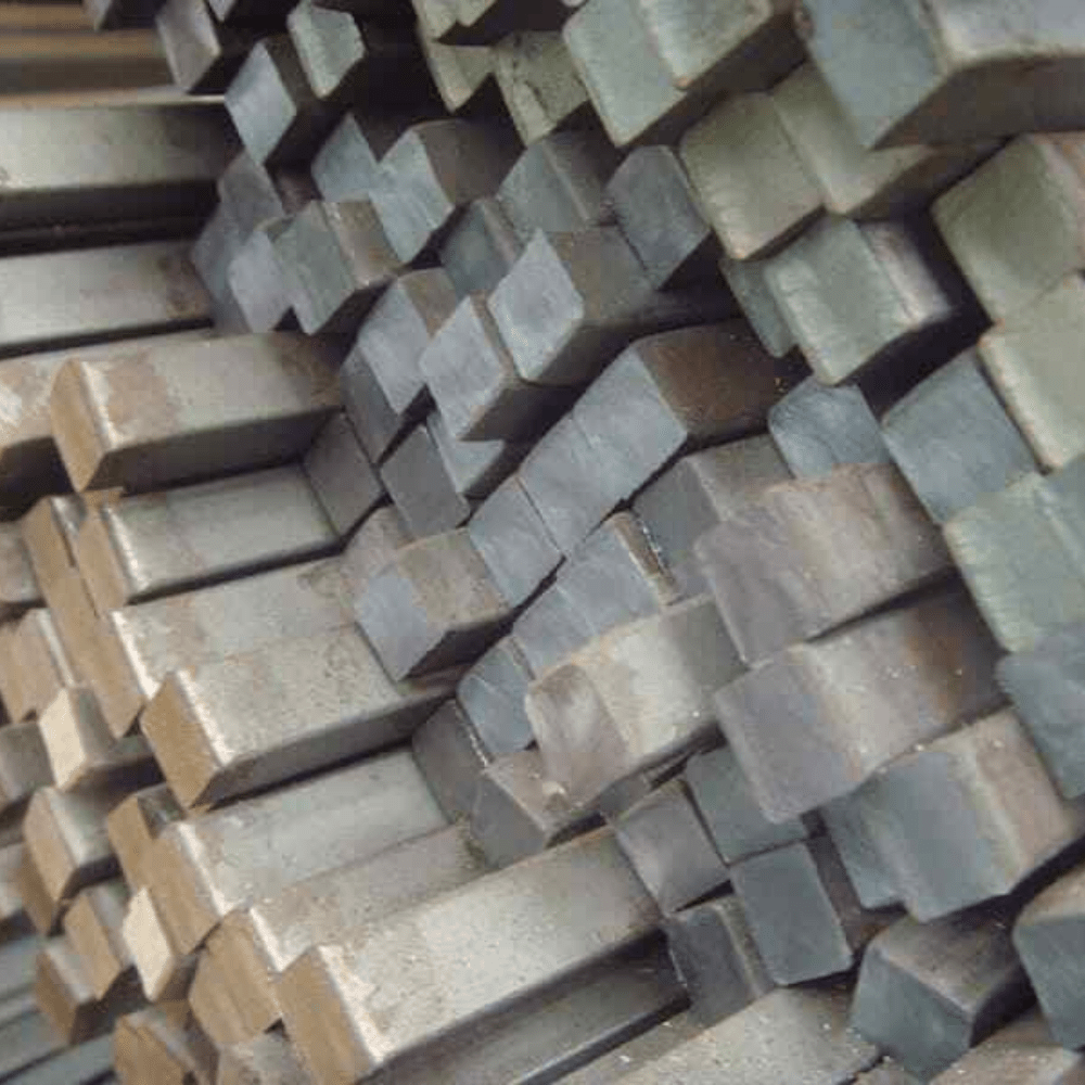 Bundle of S275 mild steel square bar 6m lengths in a UK steel yard